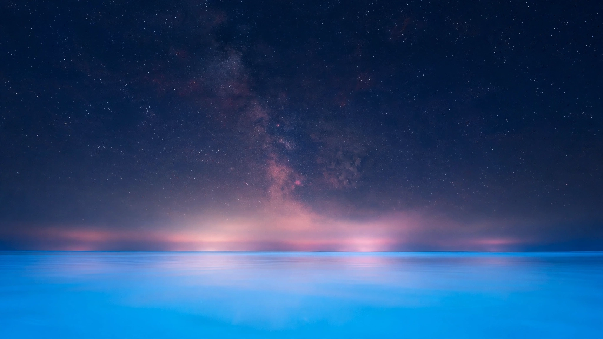 Ocean of Light — deep indigo and violet waves moving like gravity beneath calm water